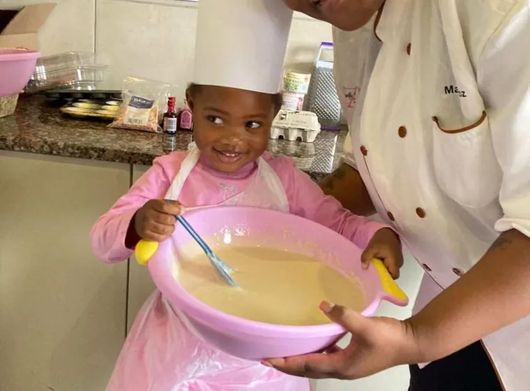 A child participating in a baking activity