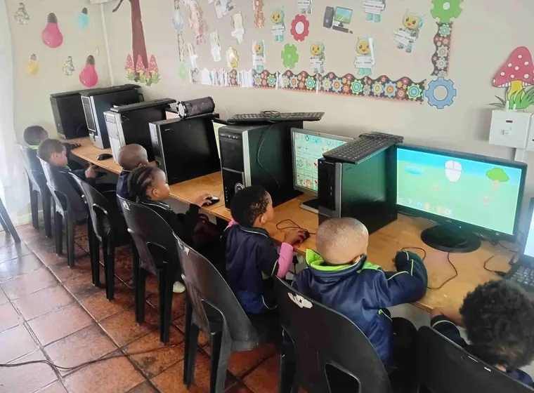 Learners using computers in a structured lesson