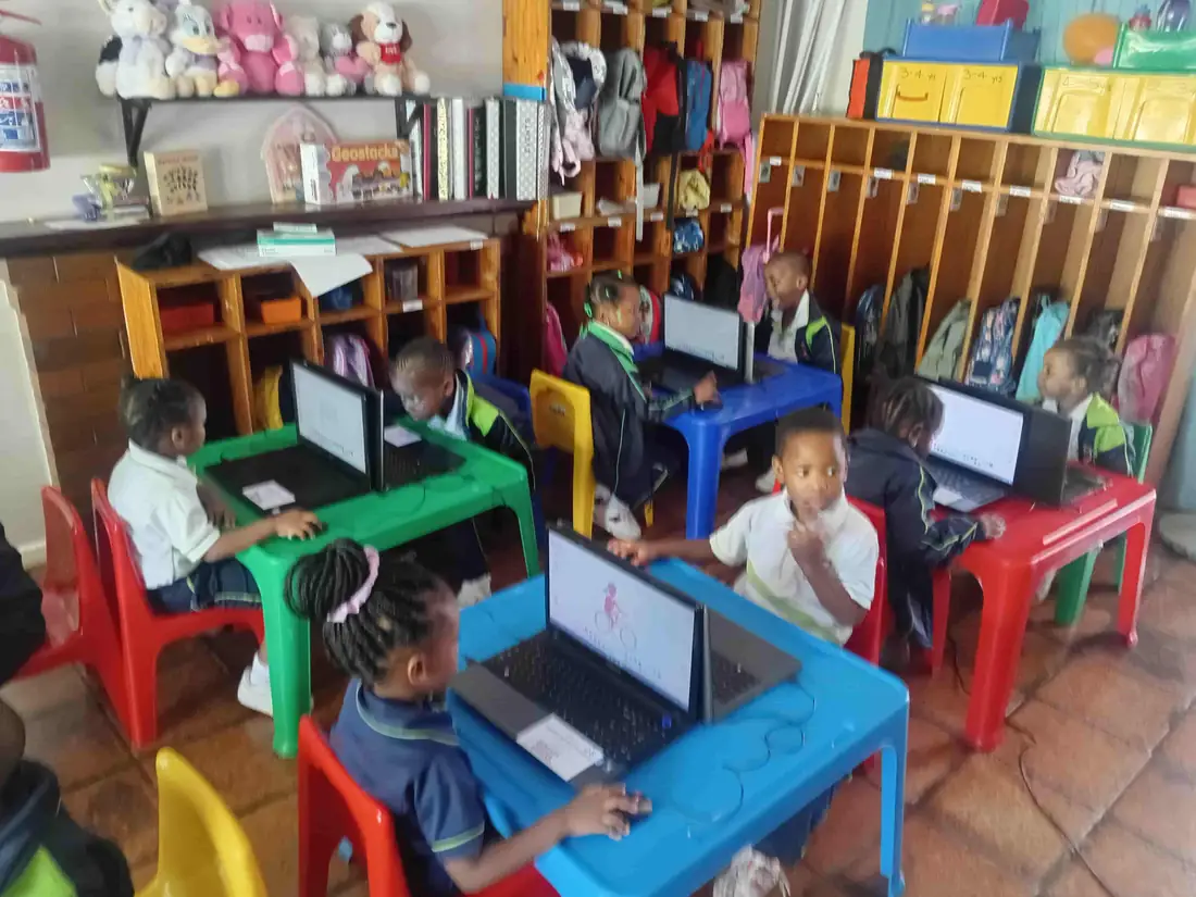 Children learning with computers in the Little Hearts computer room