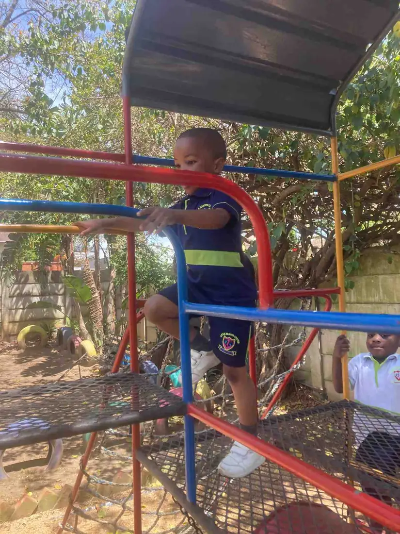 A Little Hearts learner enjoying the outdoor playground